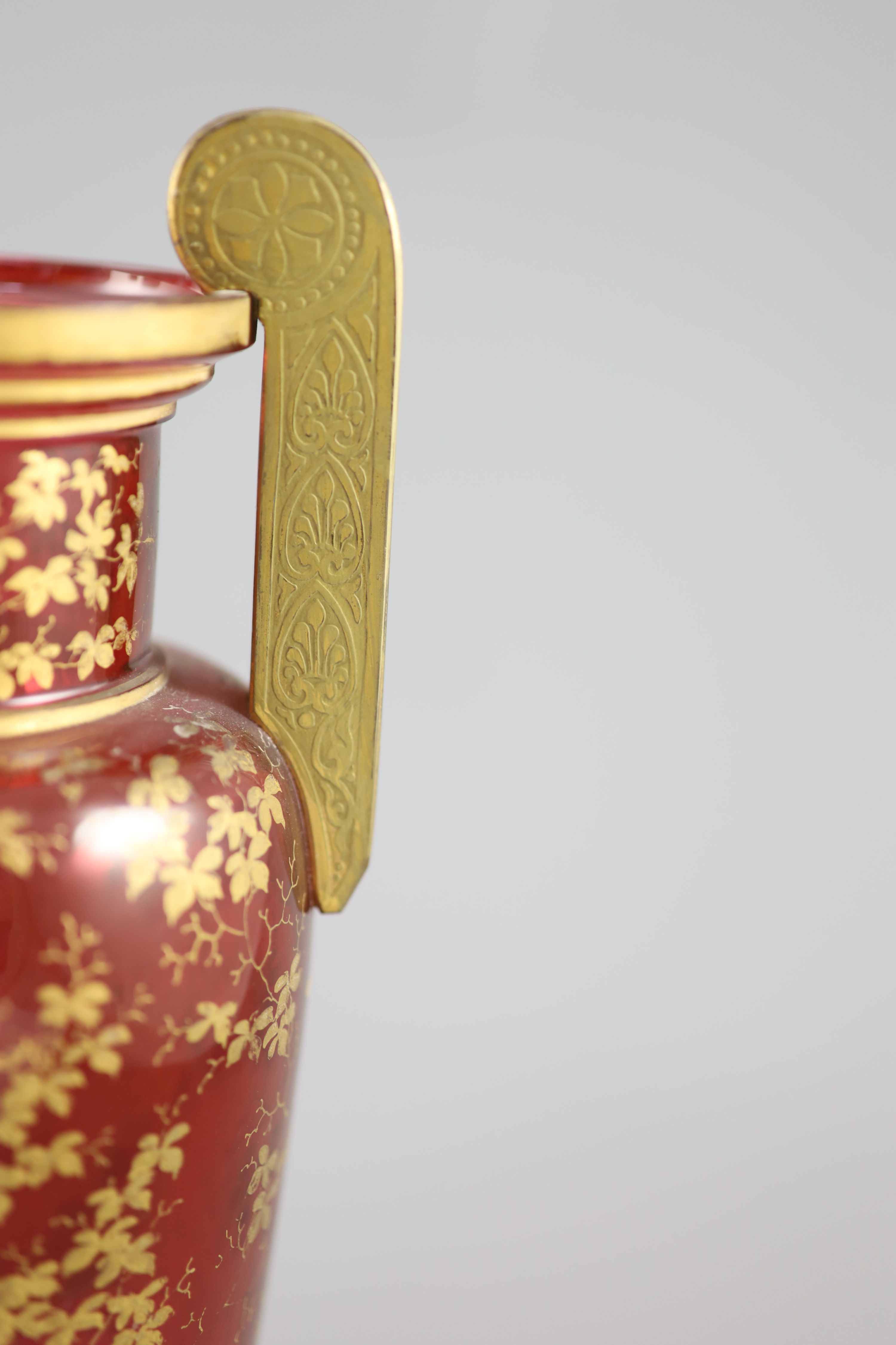 A pair of Bohemian gilt decorated ruby glass two handled vases, late 19th century, height 32cm